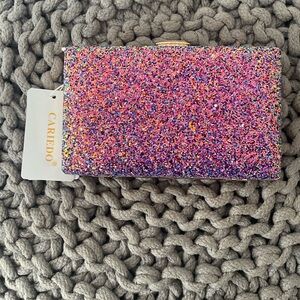 Clutch sparkles with additional strap and bag